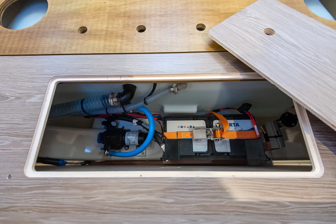 Hanse 388 interior, water pump and bow thruster's battery.